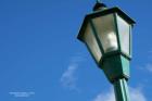 green lamp post blue sky